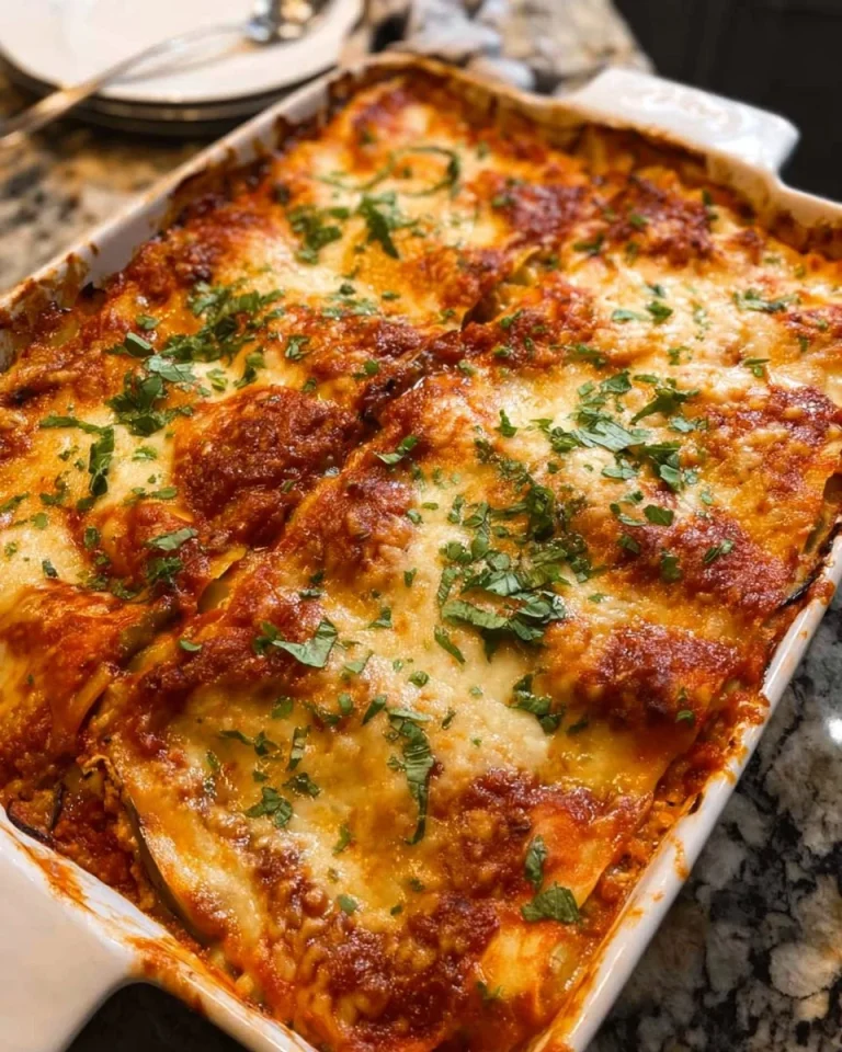Roasted eggplant lasagna with turkey, layered with cheese and fresh herbs