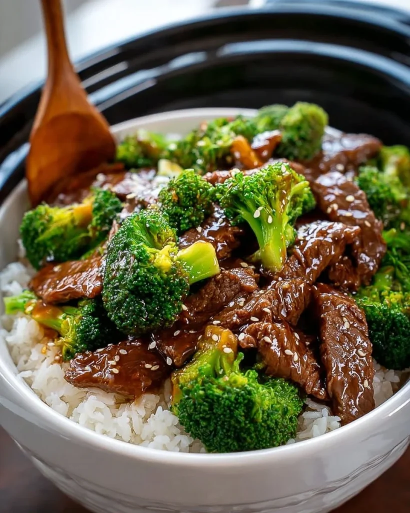 Delicious slow cooker beef and broccoli served in a bowl with rice