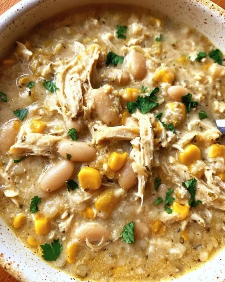 Delicious bowl of White Chicken Chili topped with cilantro and lime