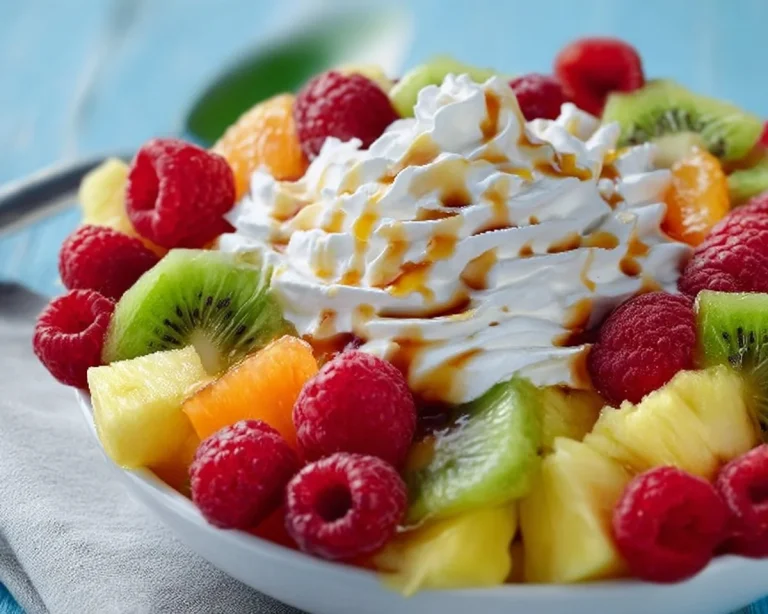 Delicious cheesecake fruit salad with fresh fruits and creamy cheesecake.