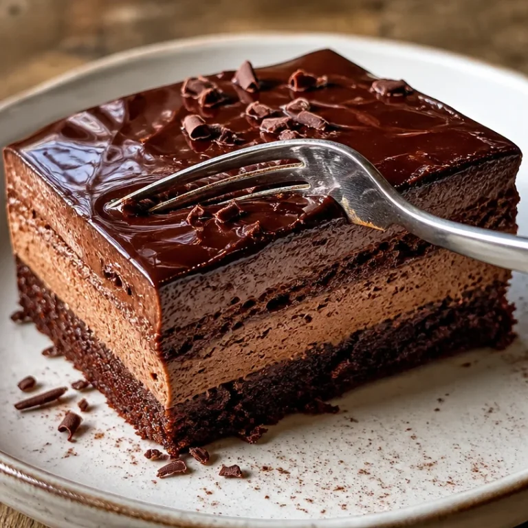 Deliciously rich Chocolate Mousse Cake topped with chocolate shavings.